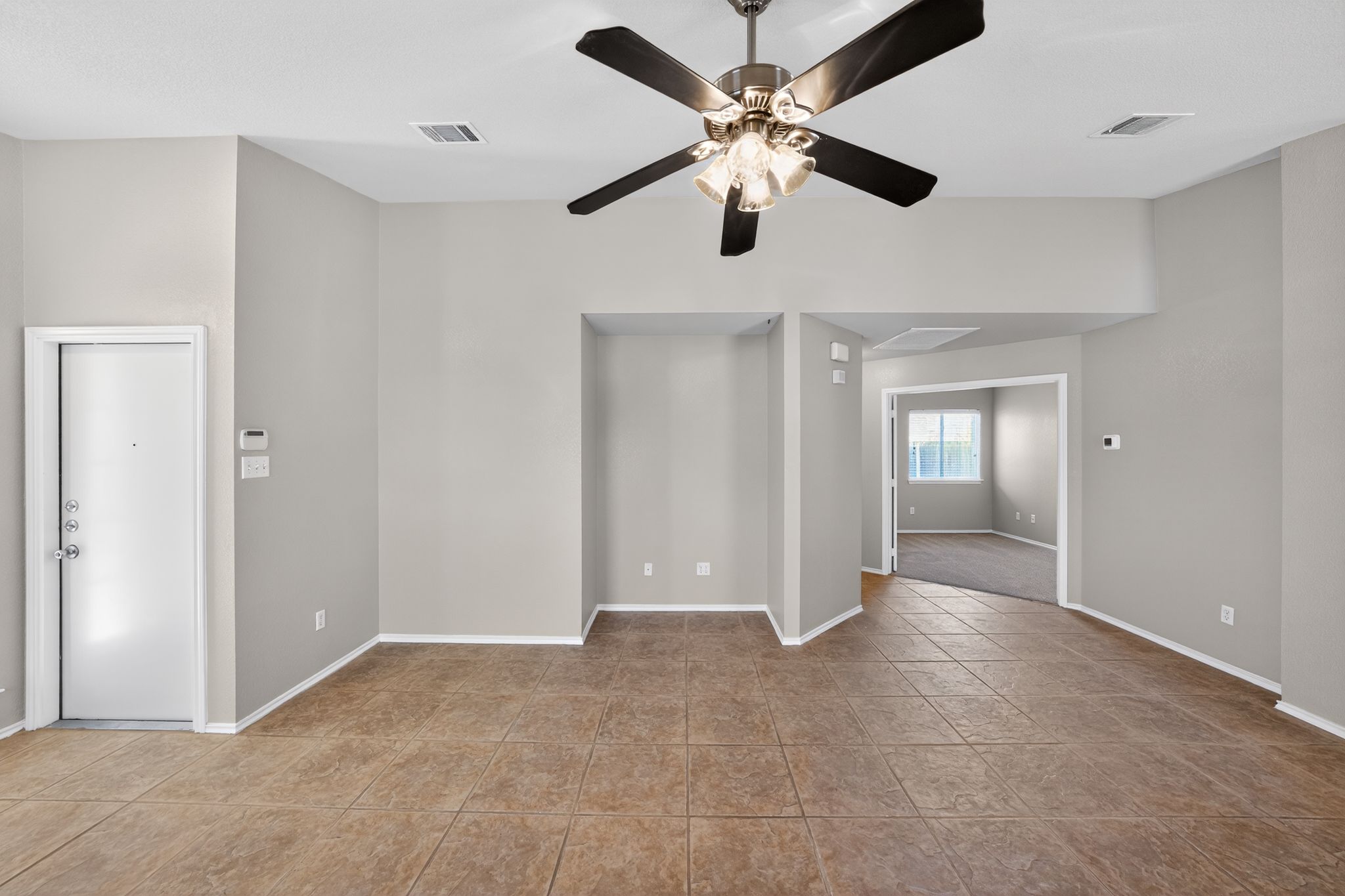 1007 Gentry Drive Leander, TX 78641 - Photo 8 of 35 a view of an empty room with a ceiling fan