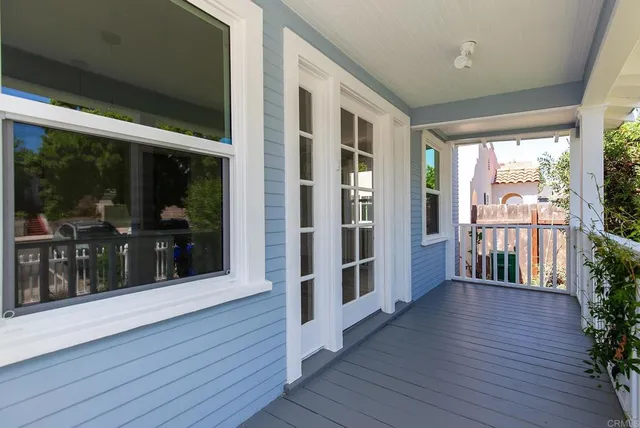 a view of a porch with wooden floor