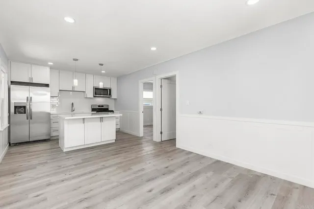 a view of kitchen with wooden floor