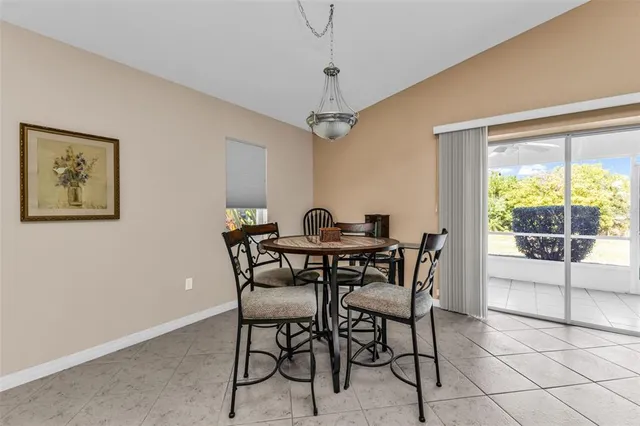 a living room with furniture a flat screen tv and a table