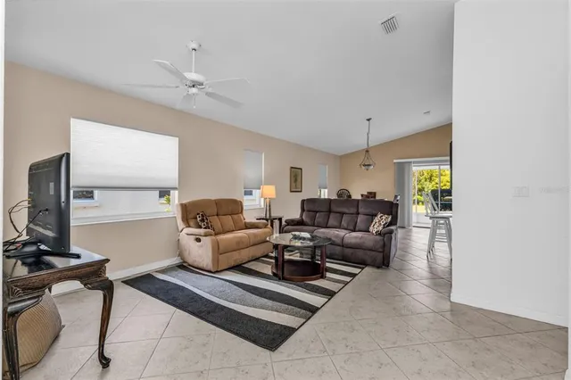 a view of a livingroom with furniture and a window