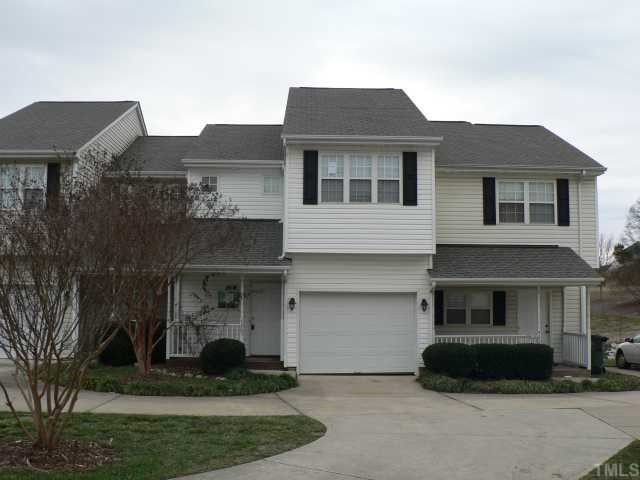 4205 Standing Rock Way Raleigh, NC 27604 - Photo 1 of 7 a front view of a house with a yard and a garage