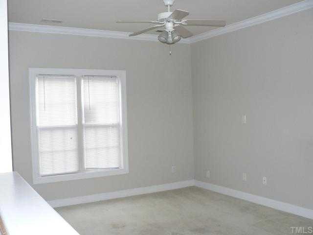 4205 Standing Rock Way Raleigh, NC 27604 - Photo 4 of 7 an empty room with a window