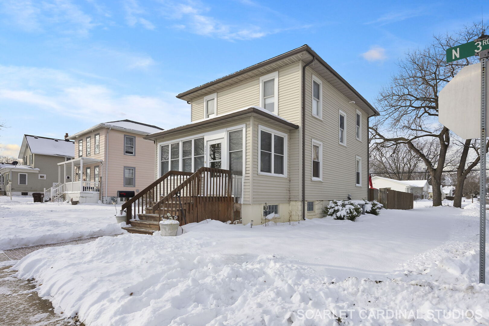 a view of a house with a snow in the yard