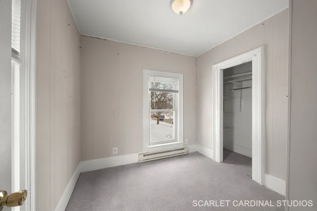 a view of an empty room with a window