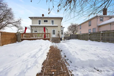 a view of a house with a snow on the road