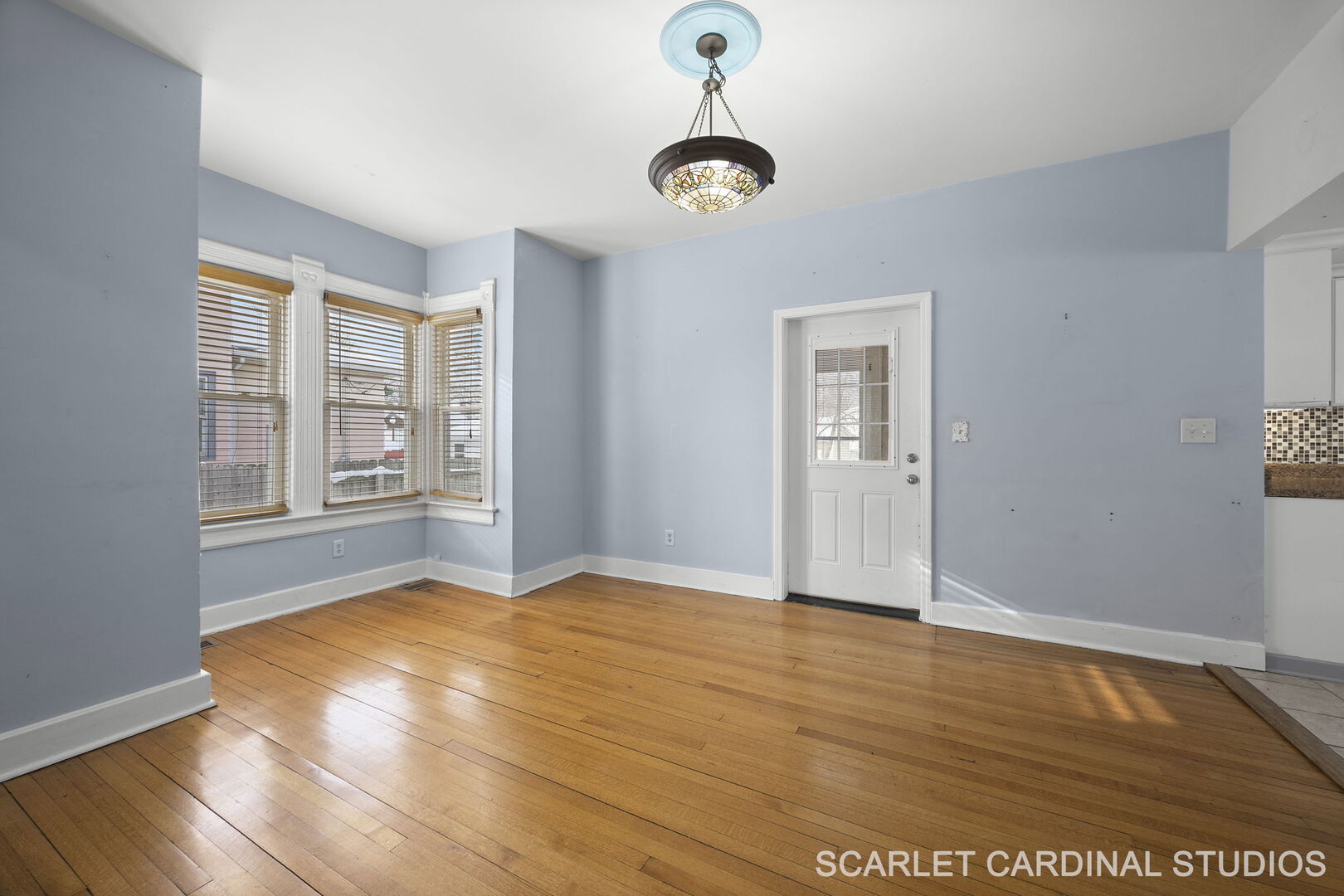 826 North 3rd Street Rochelle, IL 61068 - Photo 6 of 22 a view of an empty room with window and wooden floor