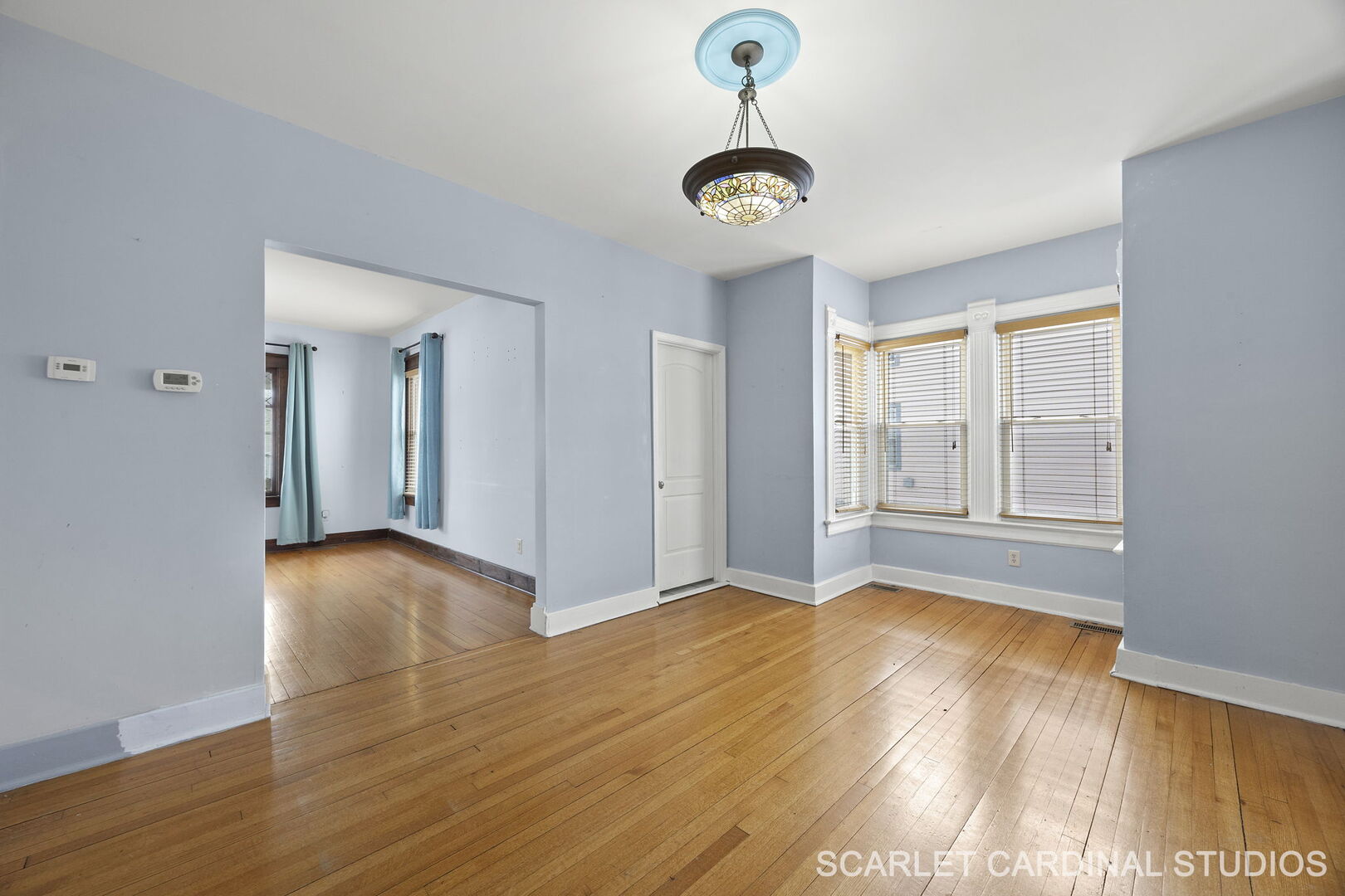 826 North 3rd Street Rochelle, IL 61068 - Photo 7 of 22 a view of an empty room with window and wooden floor