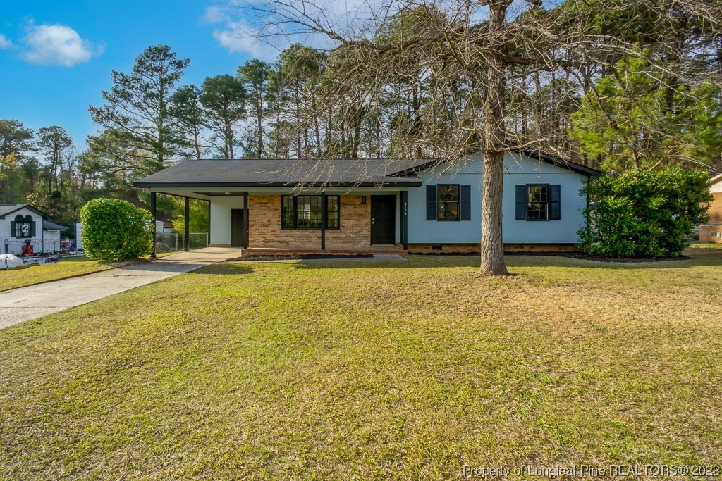 2179 Shaw Rd Extension Fayetteville, NC 28311 - Photo 1 of 42 a front view of house with yard and trees around