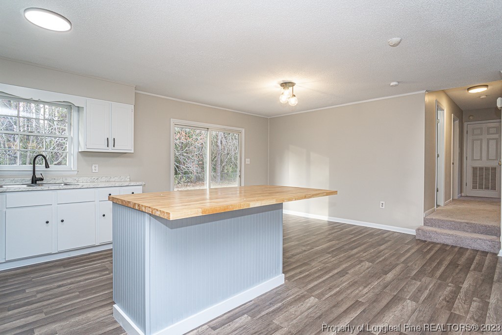 2179 Shaw Rd Extension Fayetteville, NC 28311 - Photo 15 of 42 a kitchen with granite countertop a sink and wooden floor