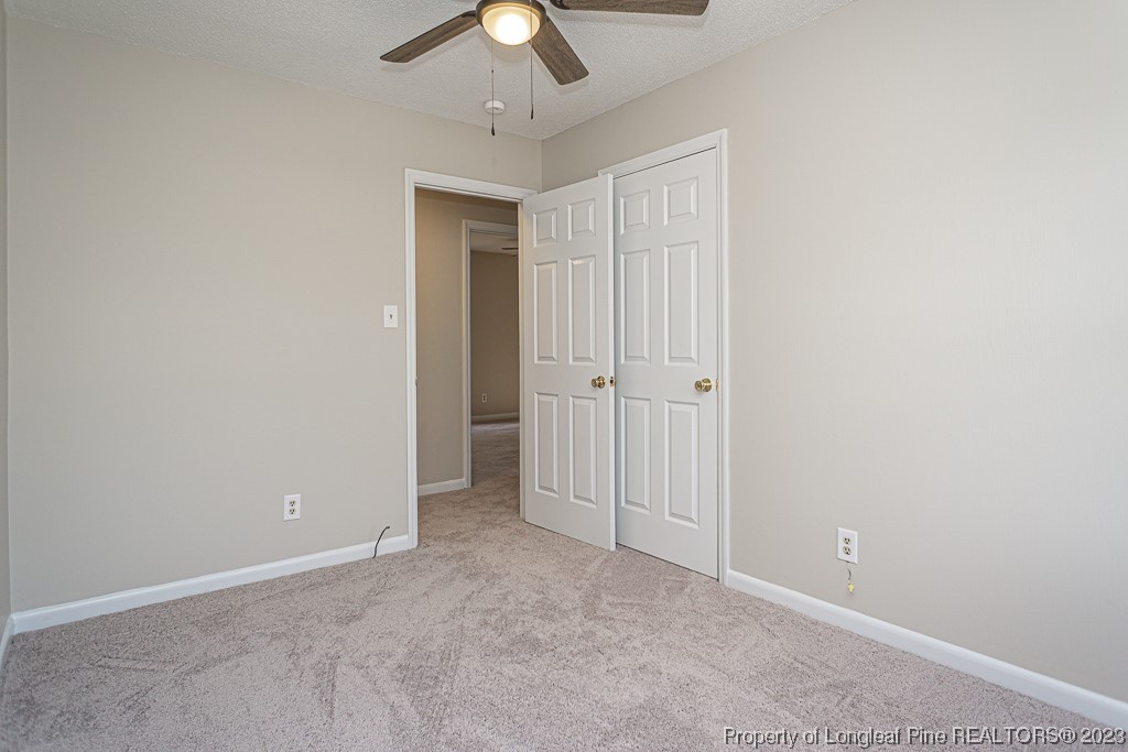 2179 Shaw Rd Extension Fayetteville, NC 28311 - Photo 20 of 42 an empty room with a ceiling fan