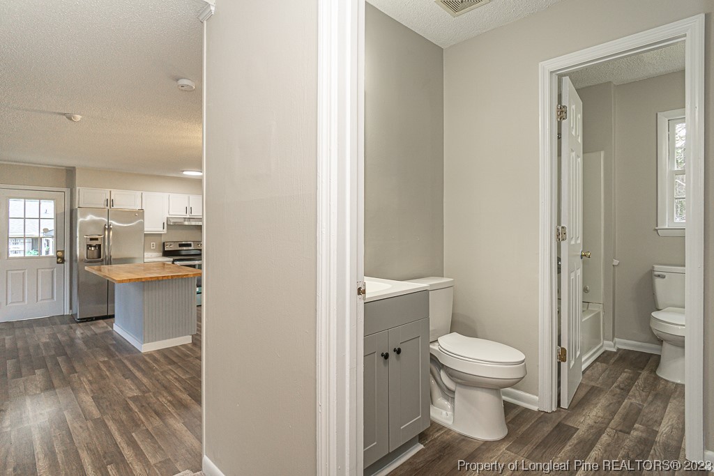 2179 Shaw Rd Extension Fayetteville, NC 28311 - Photo 23 of 42 a bathroom with a toilet sink and a mirror