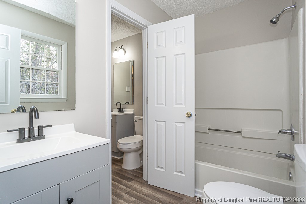 2179 Shaw Rd Extension Fayetteville, NC 28311 - Photo 24 of 42 a bathroom with a sink toilet and shower