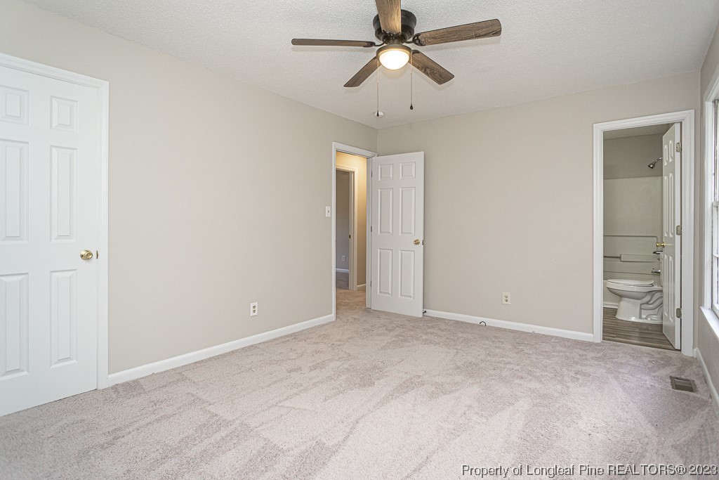 2179 Shaw Rd Extension Fayetteville, NC 28311 - Photo 33 of 42 an empty room with closet and a chandelier fan