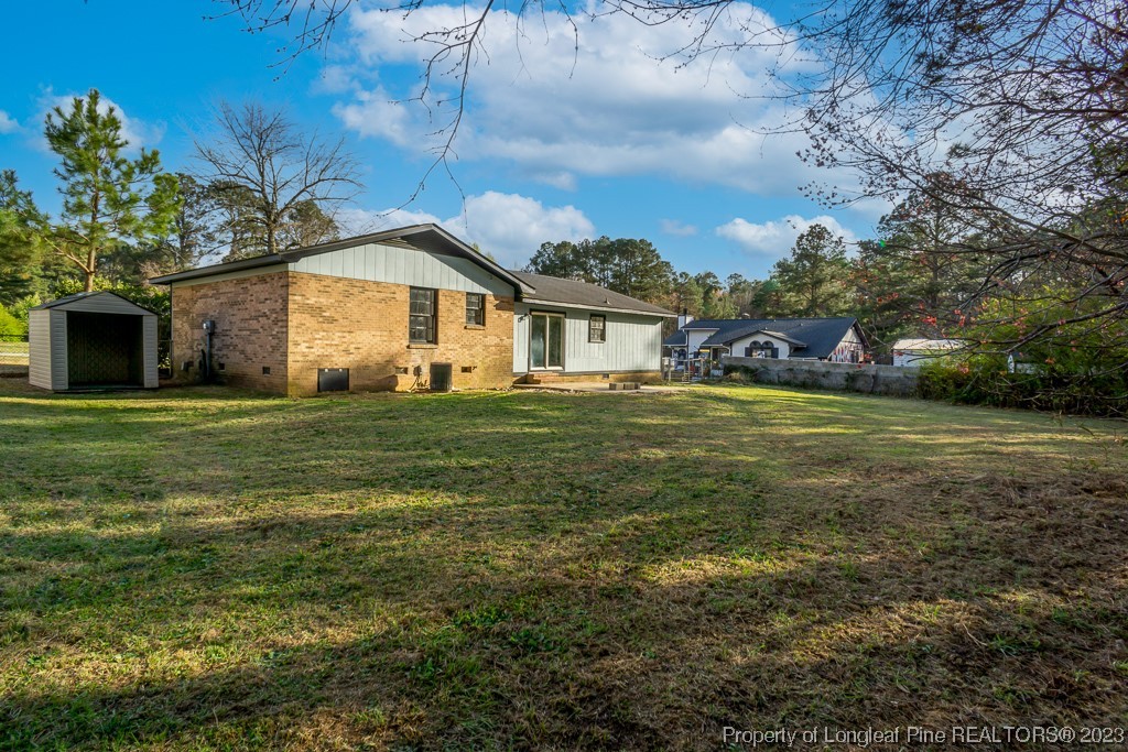 2179 Shaw Rd Extension Fayetteville, NC 28311 - Photo 41 of 42 a view of a house with a yard