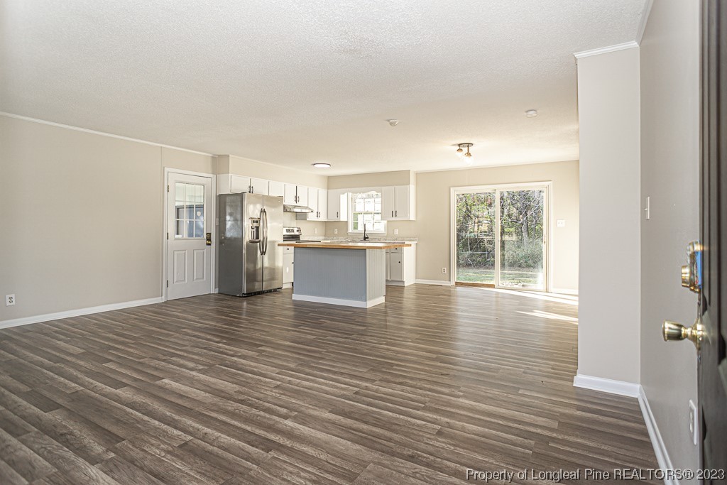 2179 Shaw Rd Extension Fayetteville, NC 28311 - Photo 6 of 42 a view of a kitchen with wooden floor and a kitchen