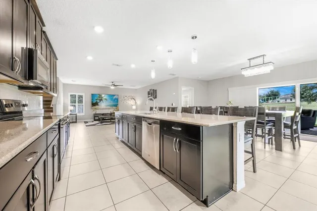 a kitchen with stainless steel appliances lots of counter top space