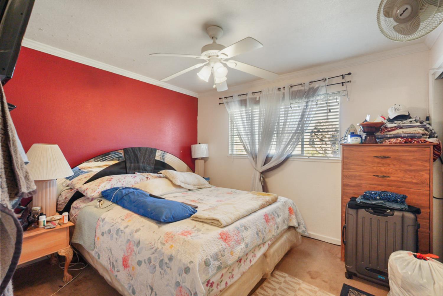 561 Church Street Modesto, CA 95357 - Photo 14 of 38 a bedroom with a bed and wooden floor