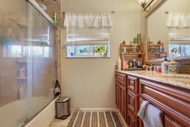 a bathroom with a sink and a shower