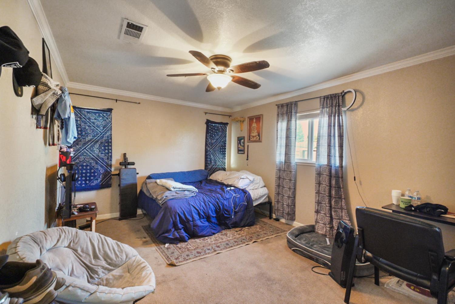 561 Church Street Modesto, CA 95357 - Photo 16 of 38 a bedroom with furniture and a window