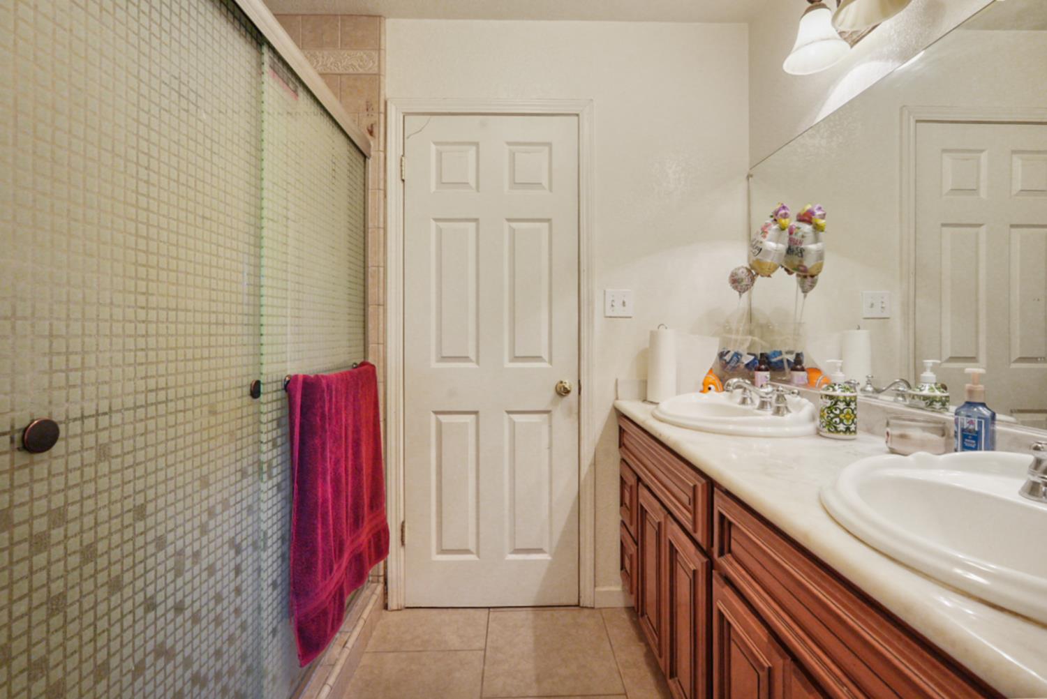561 Church Street Modesto, CA 95357 - Photo 18 of 38 a bathroom with a sink and a mirror