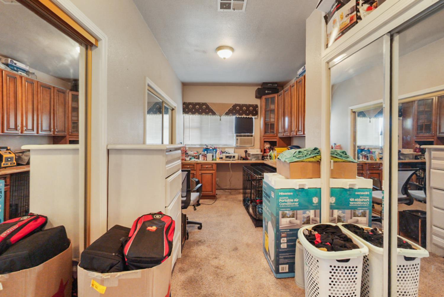 561 Church Street Modesto, CA 95357 - Photo 21 of 38 a kitchen with stainless steel appliances kitchen island granite countertop a sink and cabinets