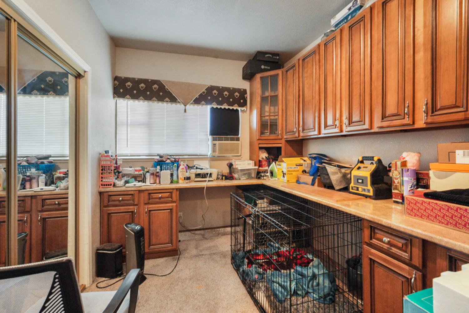 561 Church Street Modesto, CA 95357 - Photo 22 of 38 a kitchen with stainless steel appliances granite countertop a refrigerator sink and cabinets