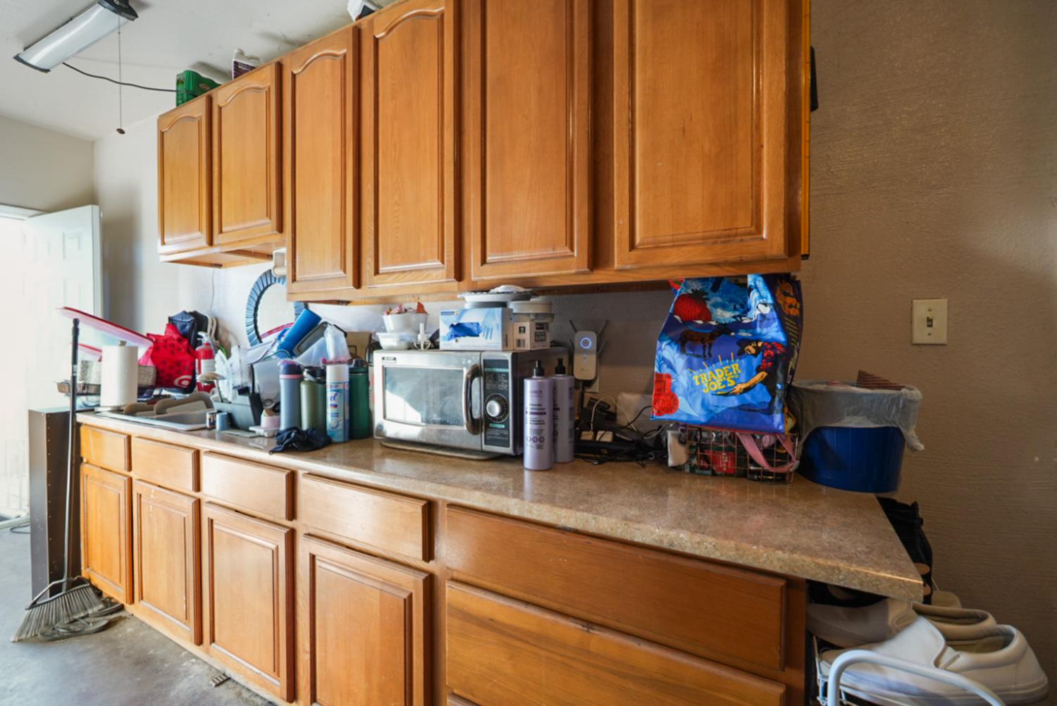 561 Church Street Modesto, CA 95357 - Photo 23 of 38 a room with stainless steel appliances furniture cabinets and a window