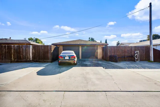 an aerial view of a house with swimming pool and porch