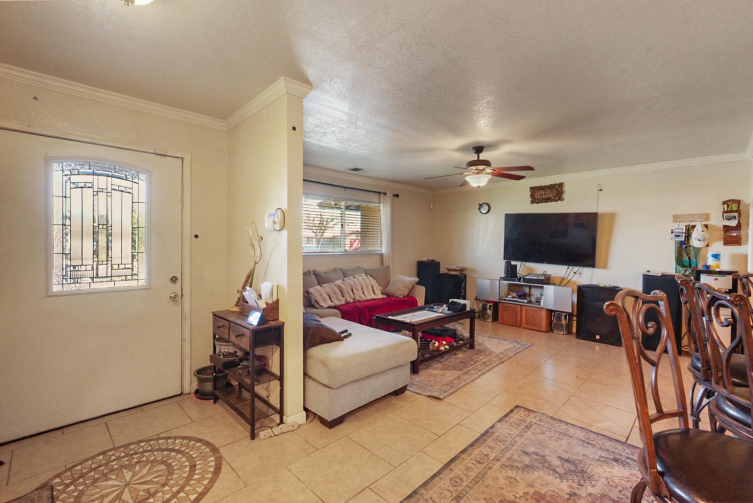 561 Church Street Modesto, CA 95357 - Photo 4 of 38 a living room with furniture and a flat screen tv