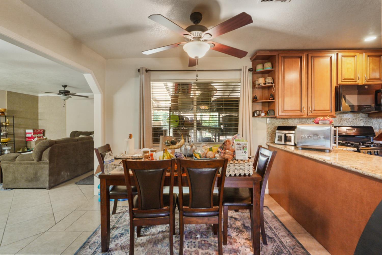 561 Church Street Modesto, CA 95357 - Photo 6 of 38 a view of a dining room with furniture window and outside view