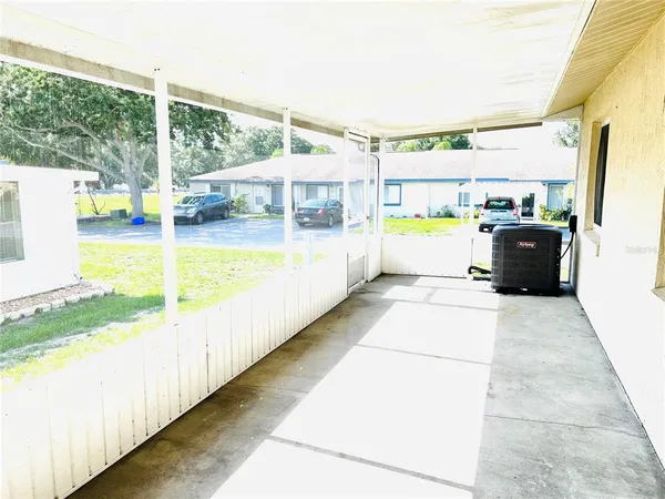 a view of a swimming pool with a porch