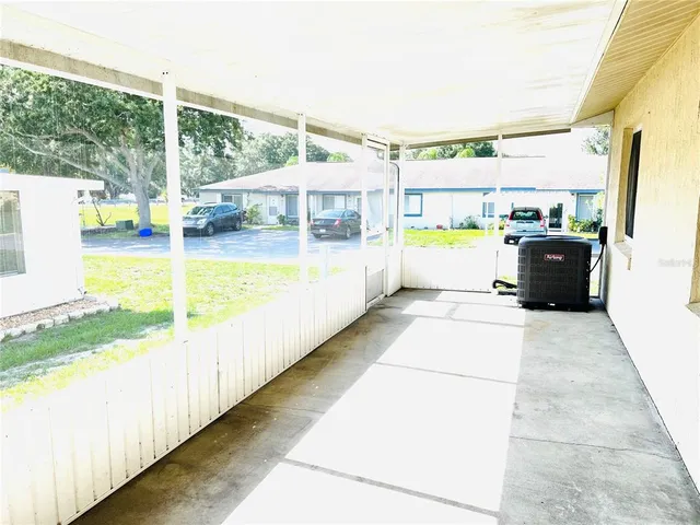 a view of a swimming pool with a porch