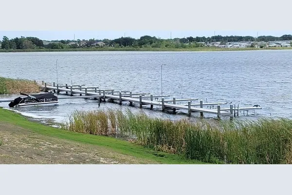 a view of a lake with houses in the back