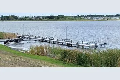 a view of a lake with houses in the back
