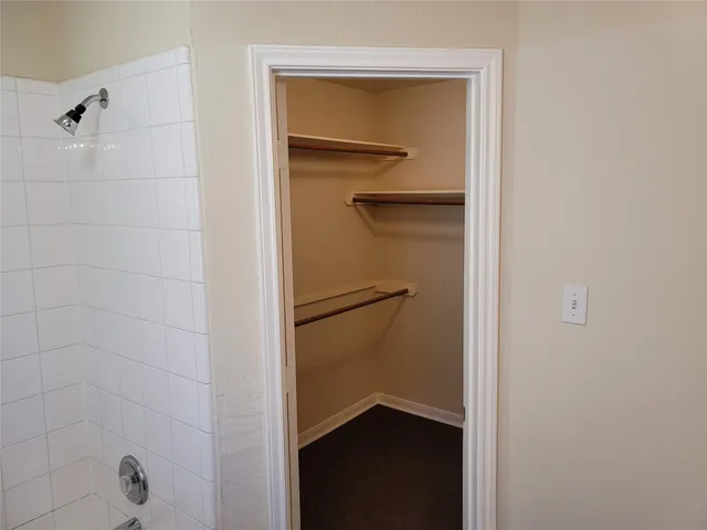 a bathroom with a glass shower door