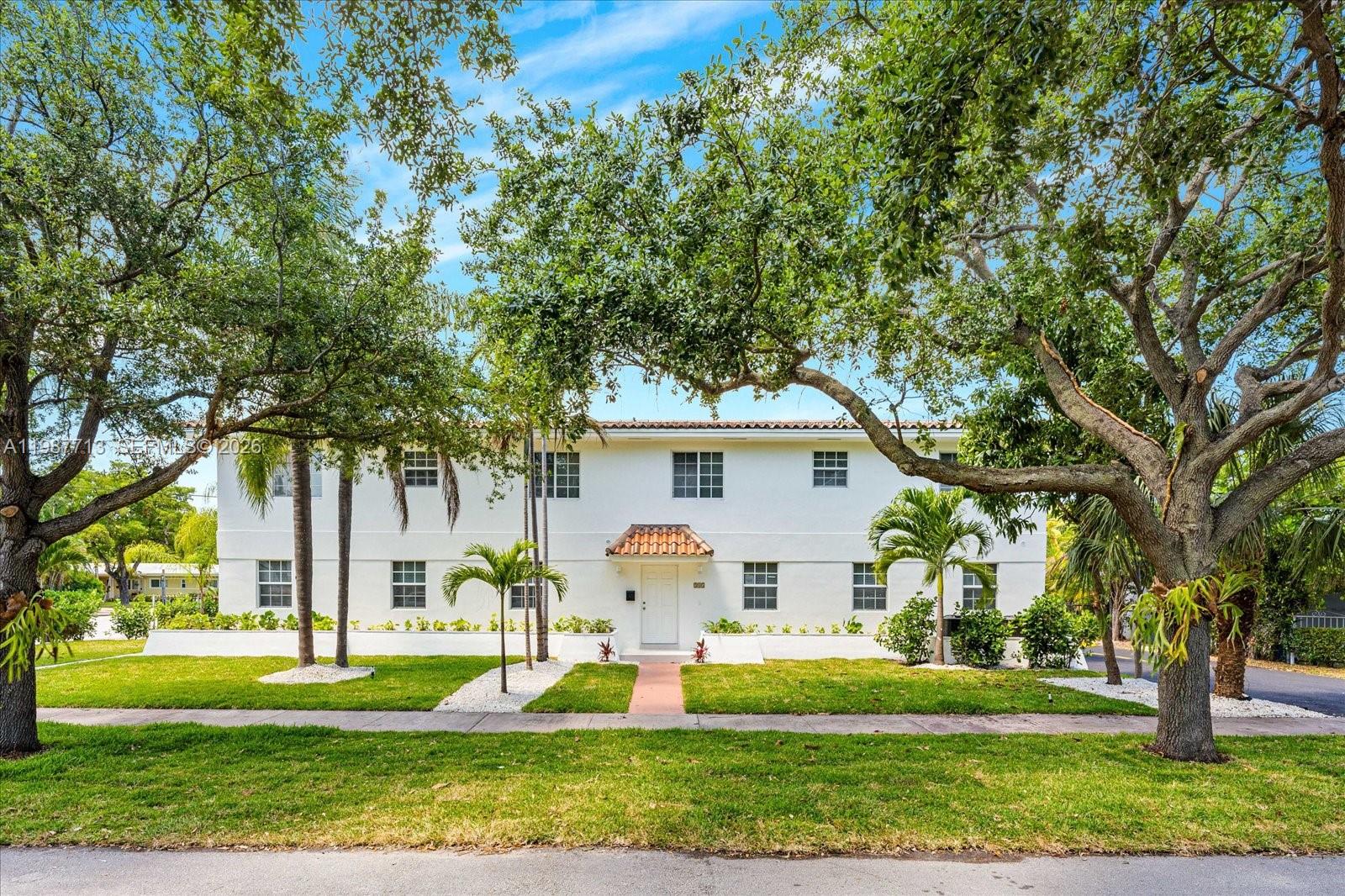 3619 South Le Jeune Road, Unit 1 Coral Gables, FL 33134 - Photo 1 of 17 a front view of a house with a yard and trees