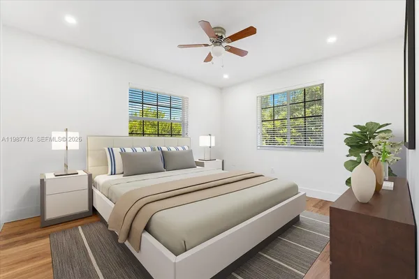 a bedroom with bed and a window