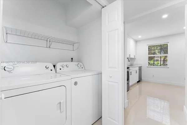 a utility room with dryer and washer