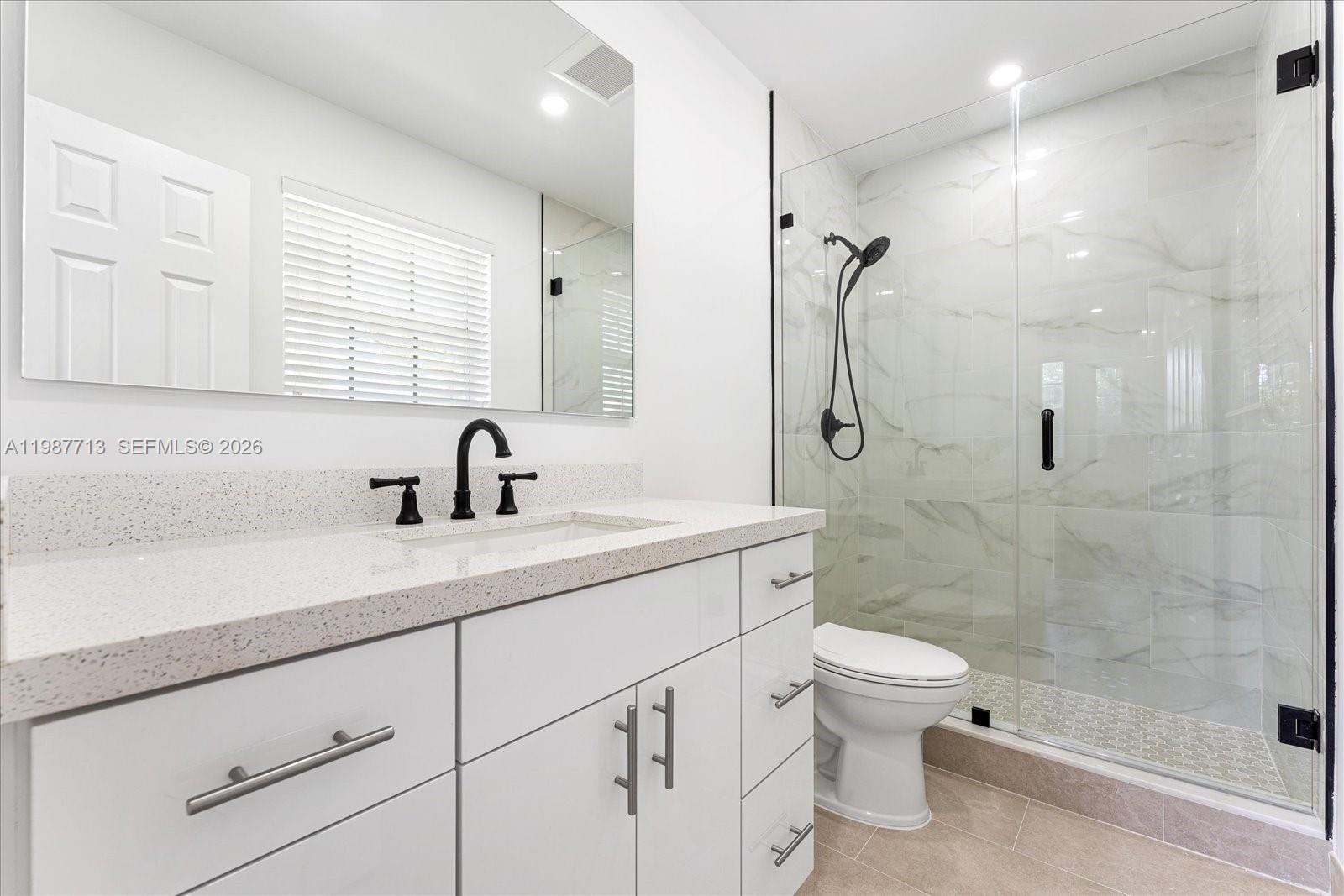 3619 South Le Jeune Road, Unit 1 Coral Gables, FL 33134 - Photo 10 of 17 a bathroom with a sink a toilet and shower
