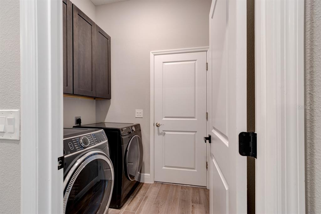 828 MIDDLETON Street DeBary, FL 32713 - Photo 15 of 20 a view of walk in closet with clothes and shoes