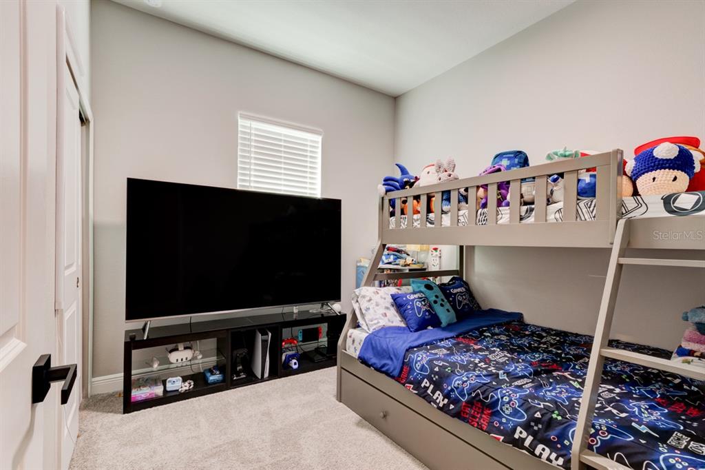 828 MIDDLETON Street DeBary, FL 32713 - Photo 17 of 20 a room with furniture and a flat screen tv