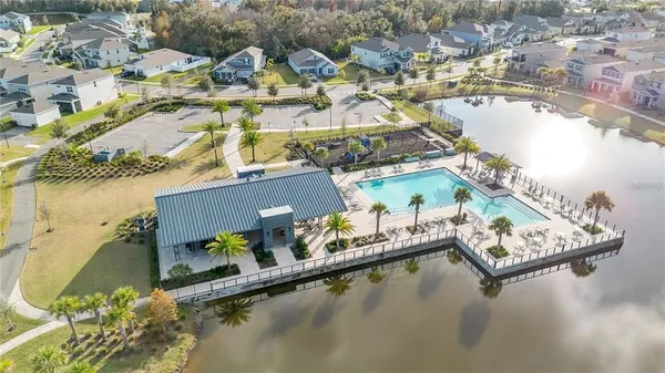 an aerial view of a house with swimming pool and outdoor space