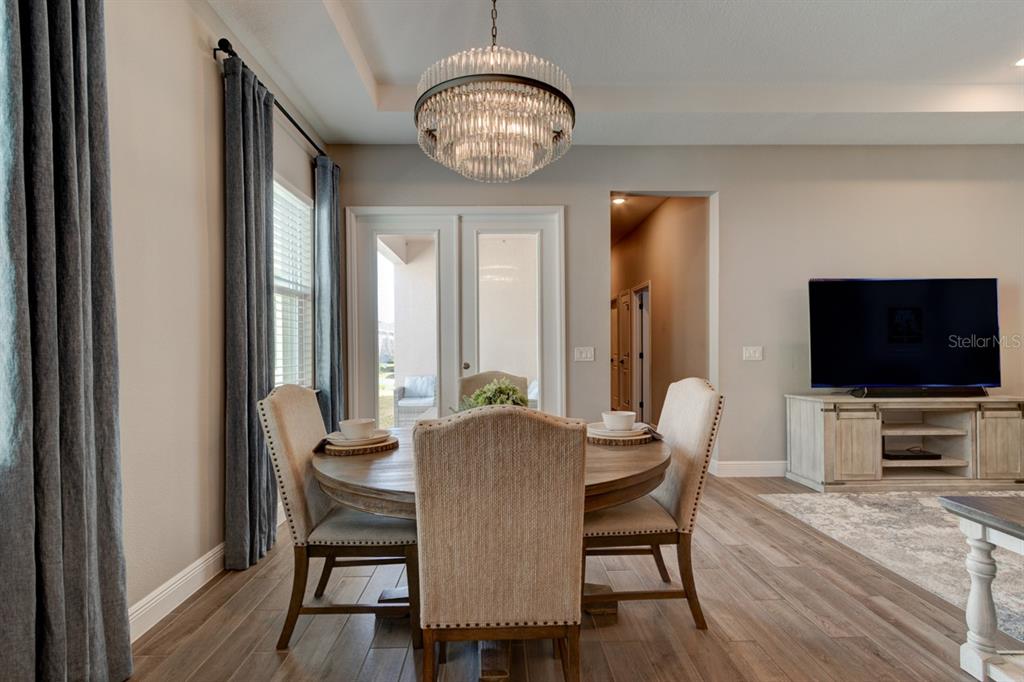 828 MIDDLETON Street DeBary, FL 32713 - Photo 6 of 20 a view of a livingroom with furniture a flat screen tv and a large window