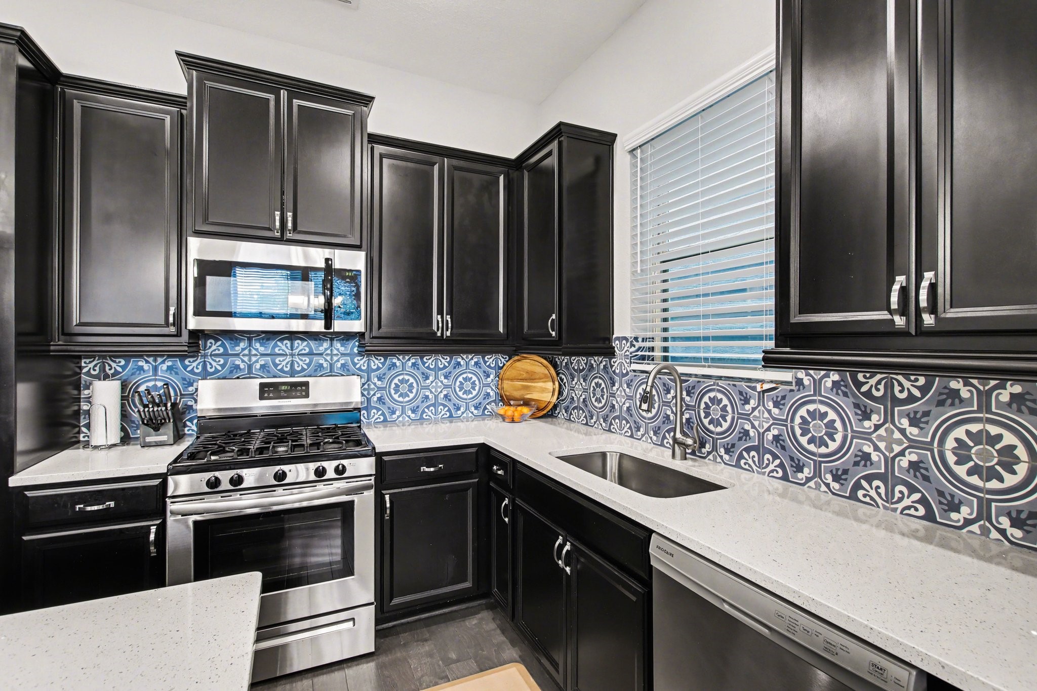 2007 Tarfite Place Houston, TX 77077 - Photo 8 of 24 a kitchen with granite countertop stainless steel appliances and wooden cabinets