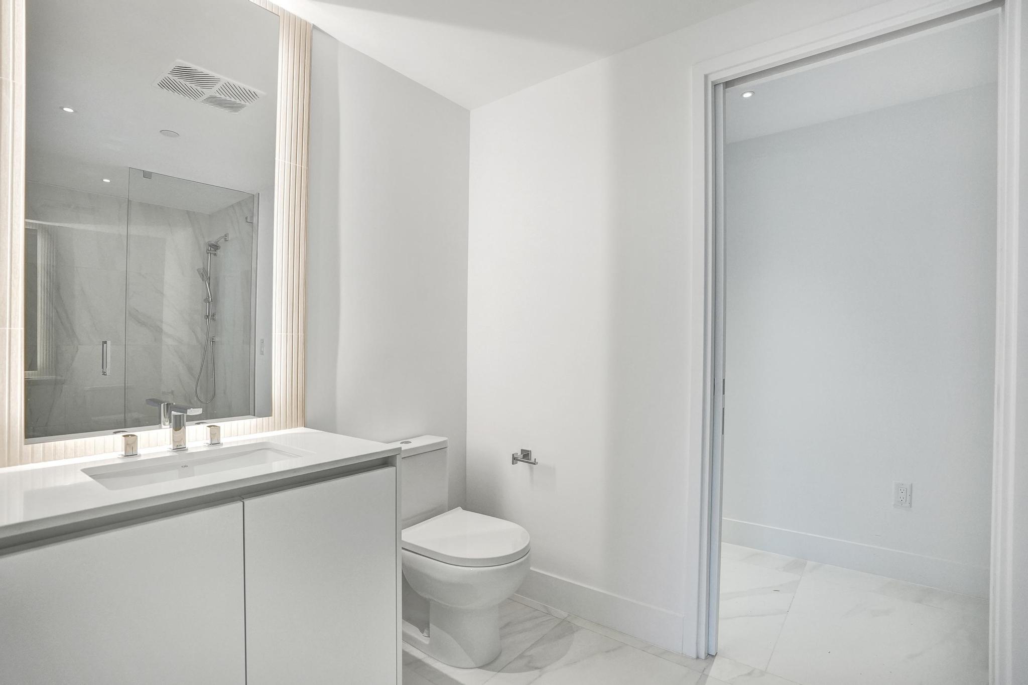 407 North Riverside Drive, Unit 303 Pompano Beach, FL 33062 - Photo 30 of 74 a bathroom with a sink a toilet and shower