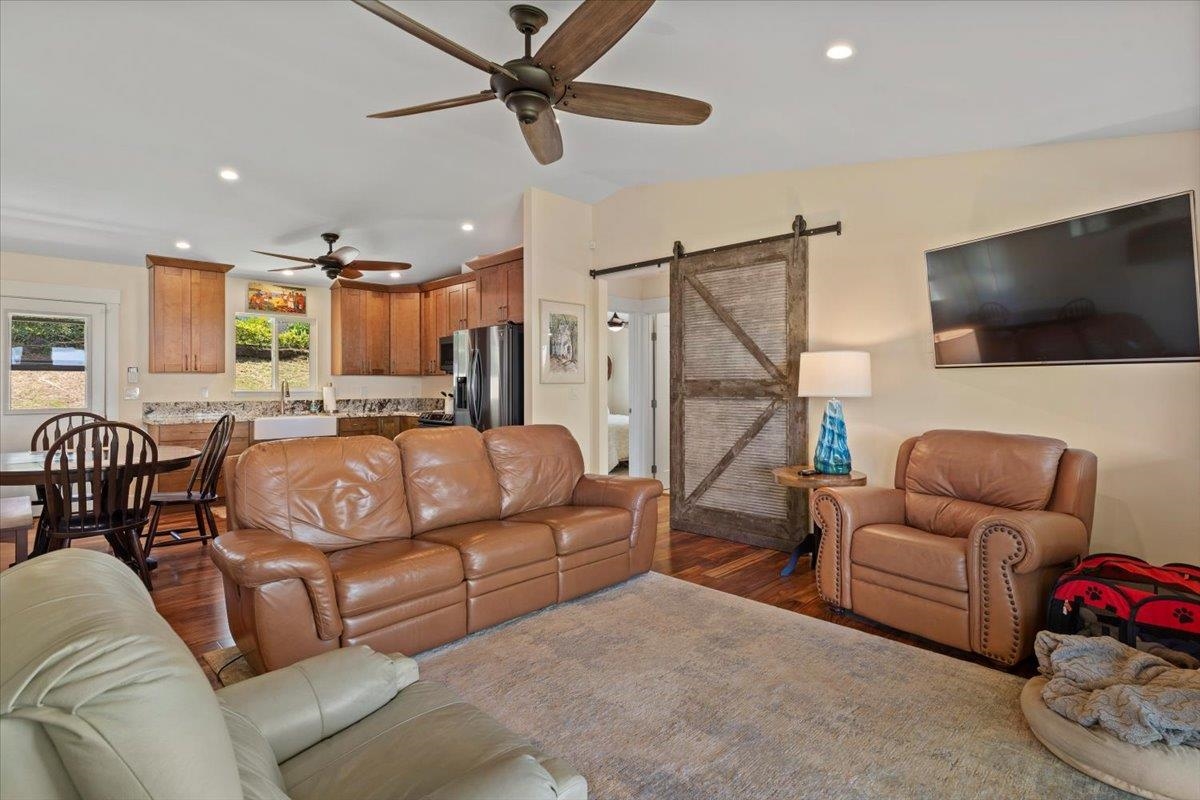 139 Pauwela Road Haiku, HI 96708 - Photo 13 of 42 a living room with furniture and a flat screen tv