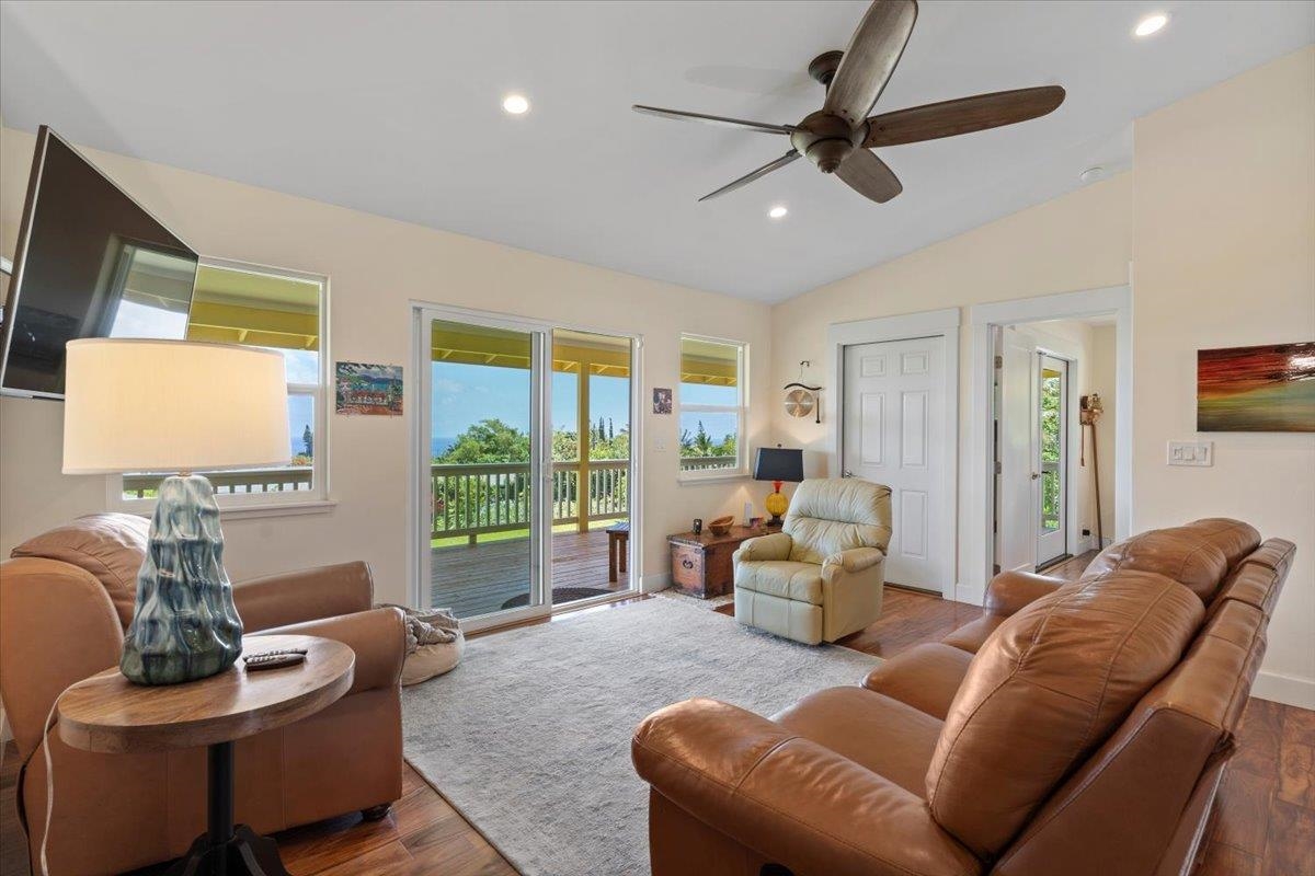 139 Pauwela Road Haiku, HI 96708 - Photo 15 of 42 a living room with furniture and a large window
