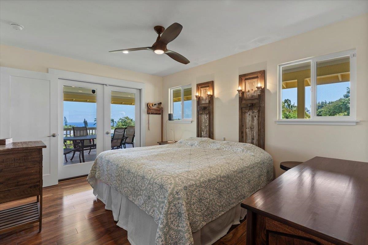 139 Pauwela Road Haiku, HI 96708 - Photo 18 of 42 a bedroom with a bed and window