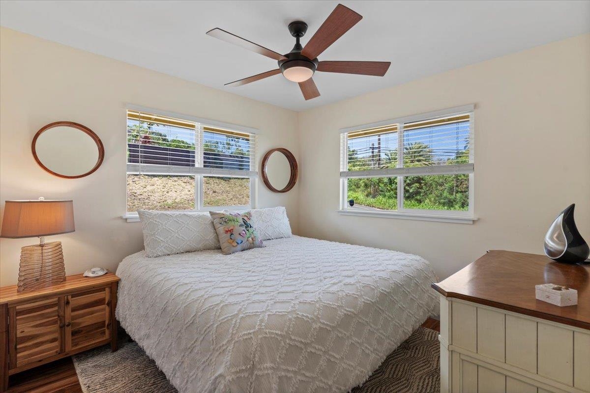 139 Pauwela Road Haiku, HI 96708 - Photo 20 of 42 a bedroom with a bed and a window